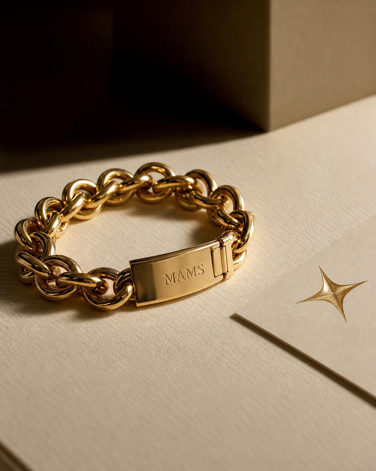 MAMS Heirloom Link Bracelet in 21K yellow gold, coiled softly on ivory paper